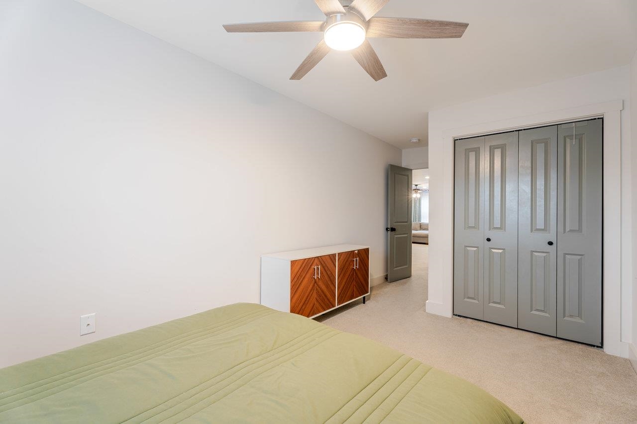 34 Field Court Bridgewater, VA 22812 - Photo 33 of 42 a bedroom with a bed and a chandelier