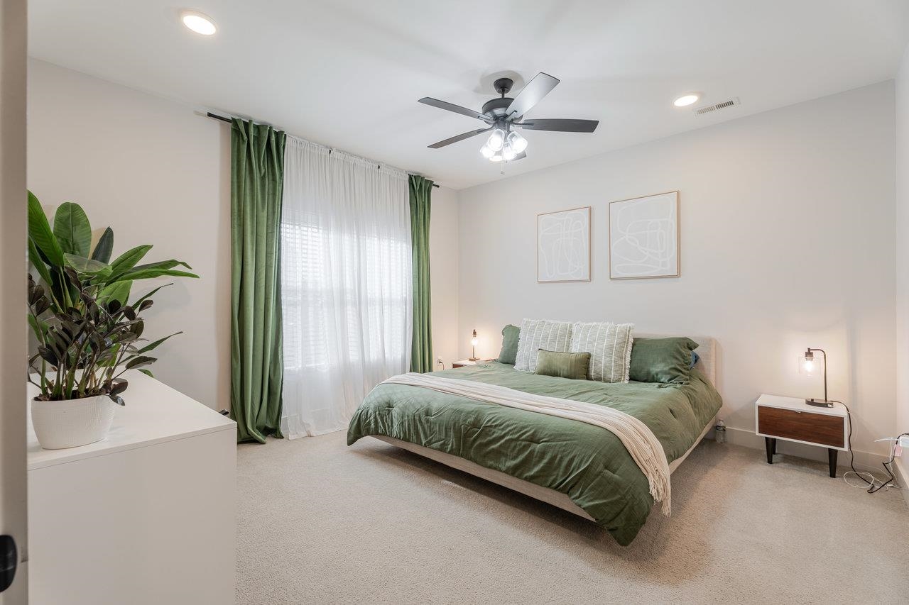 34 Field Court Bridgewater, VA 22812 - Photo 5 of 42 a bedroom with a bed and a chandelier