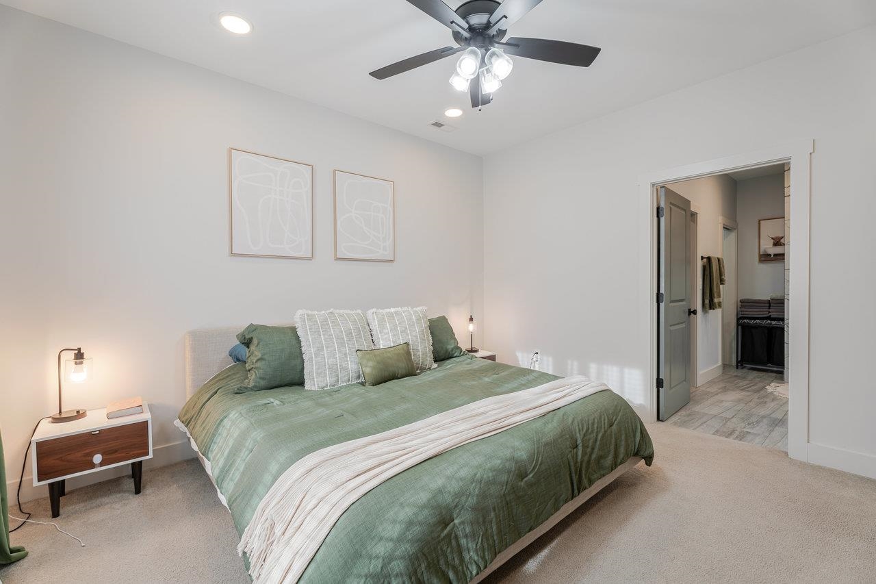 34 Field Court Bridgewater, VA 22812 - Photo 6 of 42 a bedroom with a bed and a chandelier