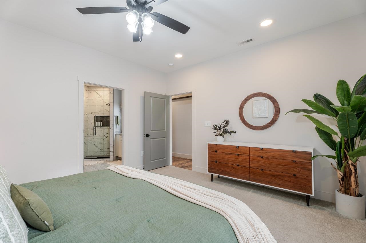 34 Field Court Bridgewater, VA 22812 - Photo 7 of 42 a bedroom with a bed and a potted plant