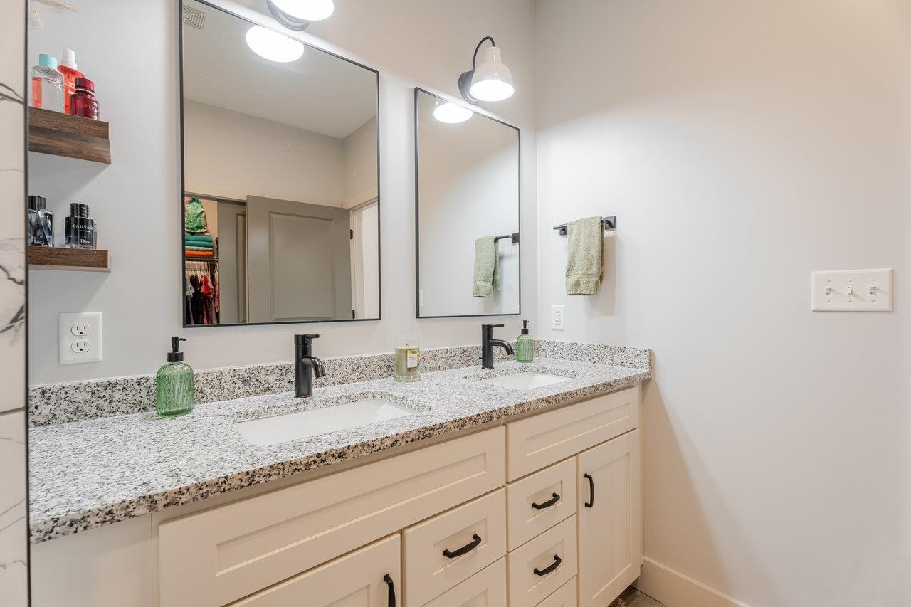 34 Field Court Bridgewater, VA 22812 - Photo 10 of 42 a bathroom with a granite countertop sink double and mirror