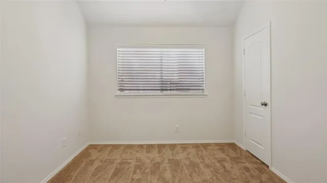 a view of a room that has a window in it