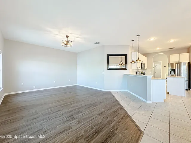 a view of a kitchen with windows