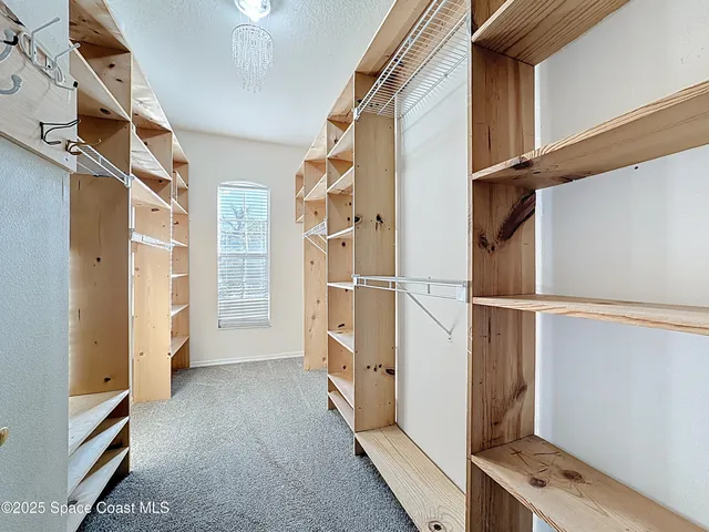 a view of an empty room and utility room