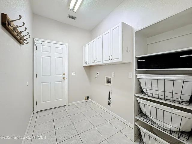 a view of a swimming pool with a lounge chair