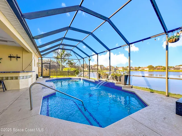 a view of a patio with a table and chairs