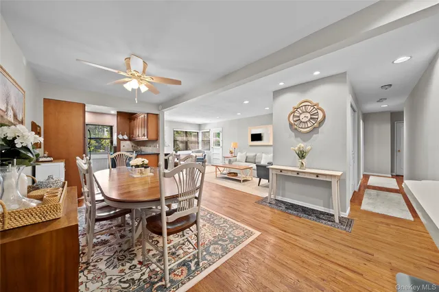 a living room with furniture and a clock