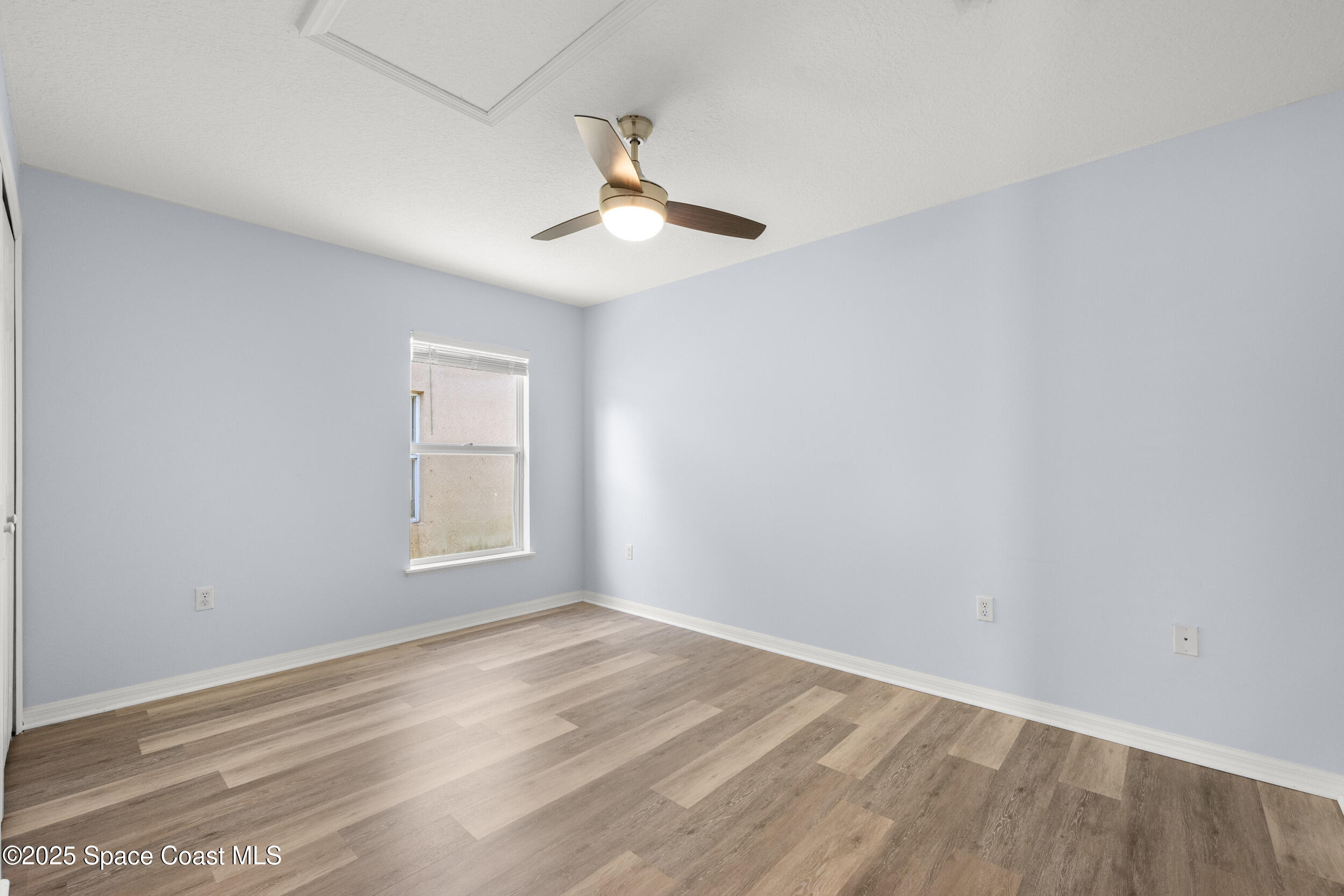 2100 Canopy Drive Melbourne, FL 32935 - Photo 14 of 53 wooden floor in an empty room with a window
