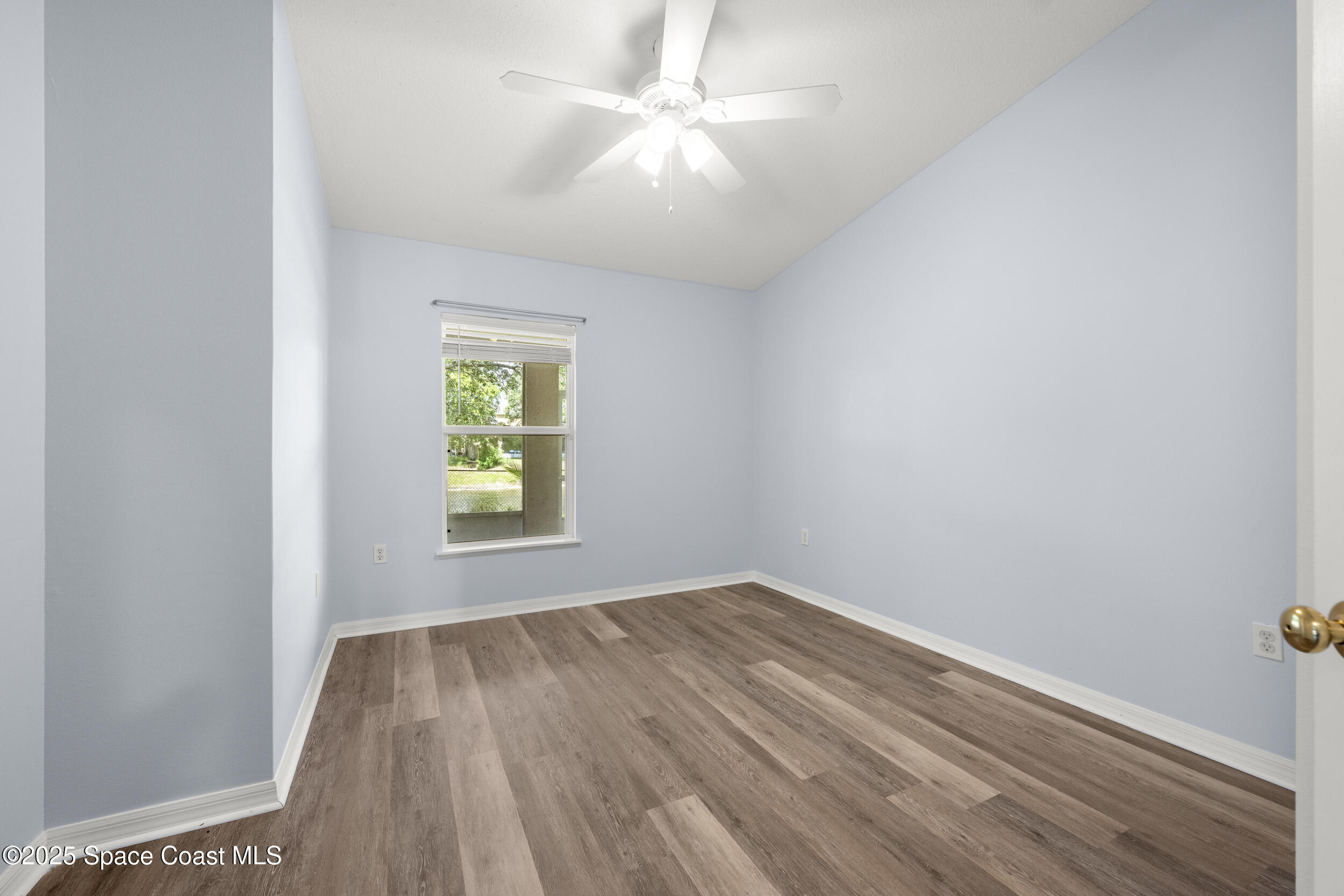 2100 Canopy Drive Melbourne, FL 32935 - Photo 15 of 53 wooden floor in an empty room with a window