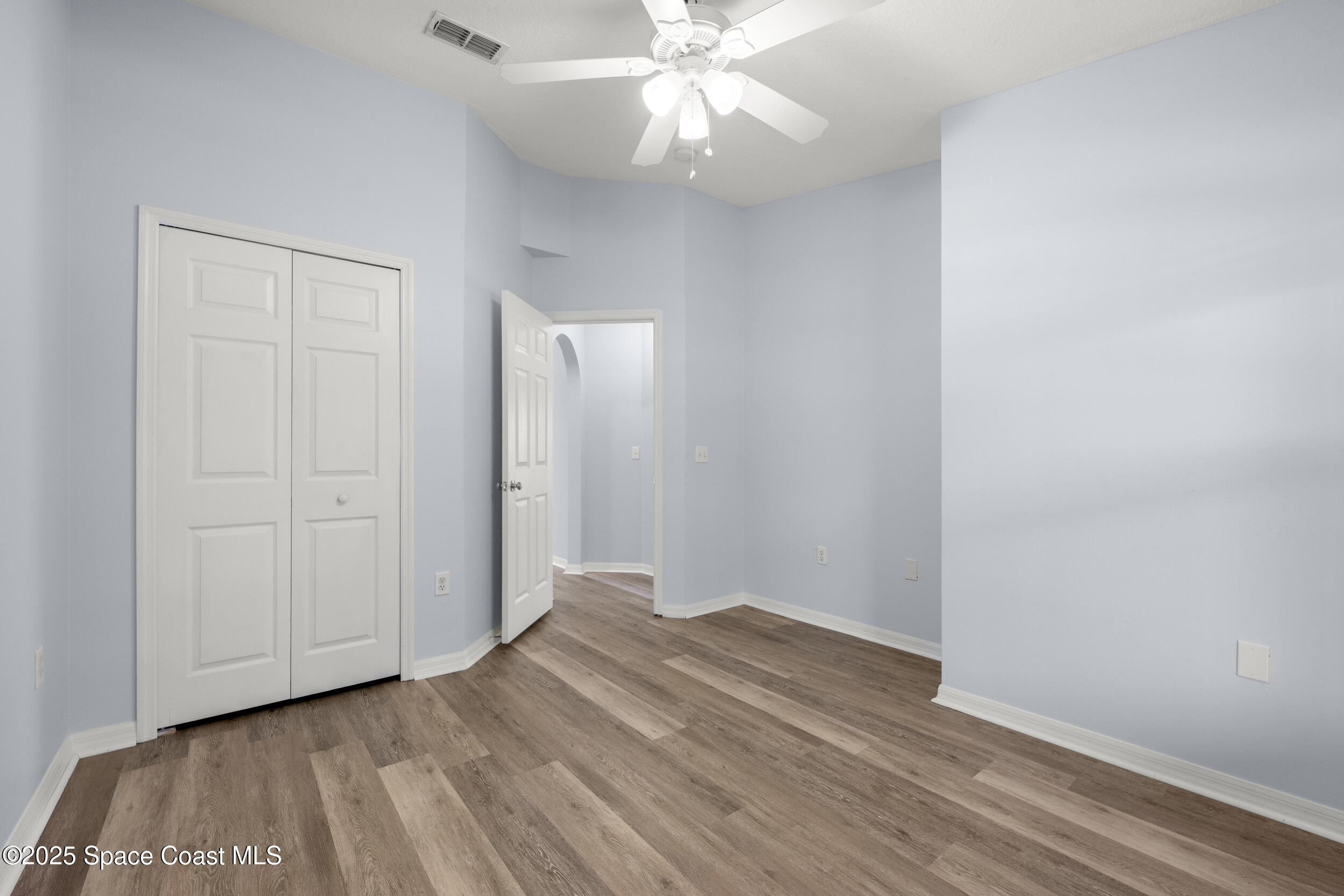 2100 Canopy Drive Melbourne, FL 32935 - Photo 16 of 53 a view of an empty room with wooden floor