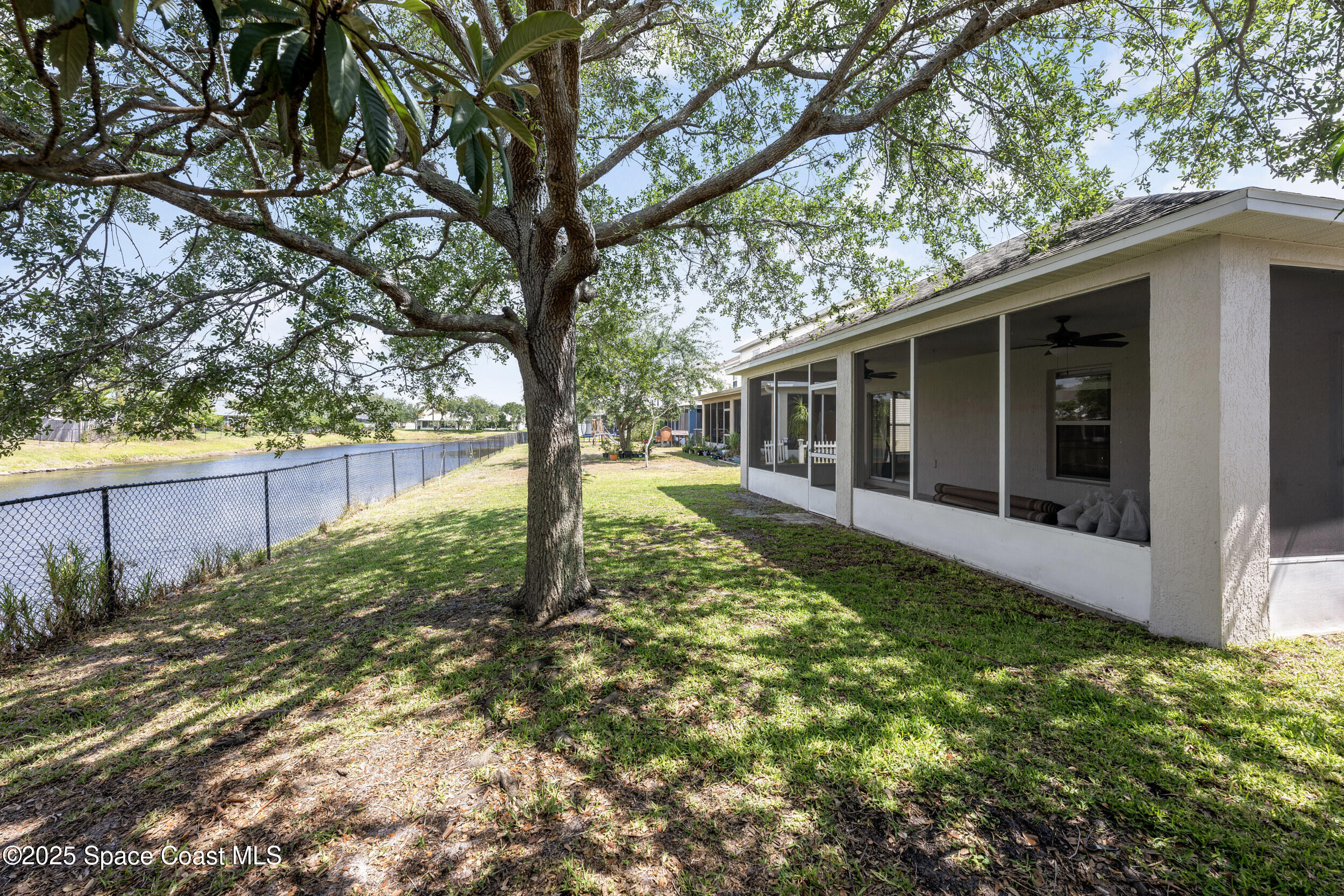 2100 Canopy Drive Melbourne, FL 32935 - Photo 20 of 53 a view of a house with a backyard