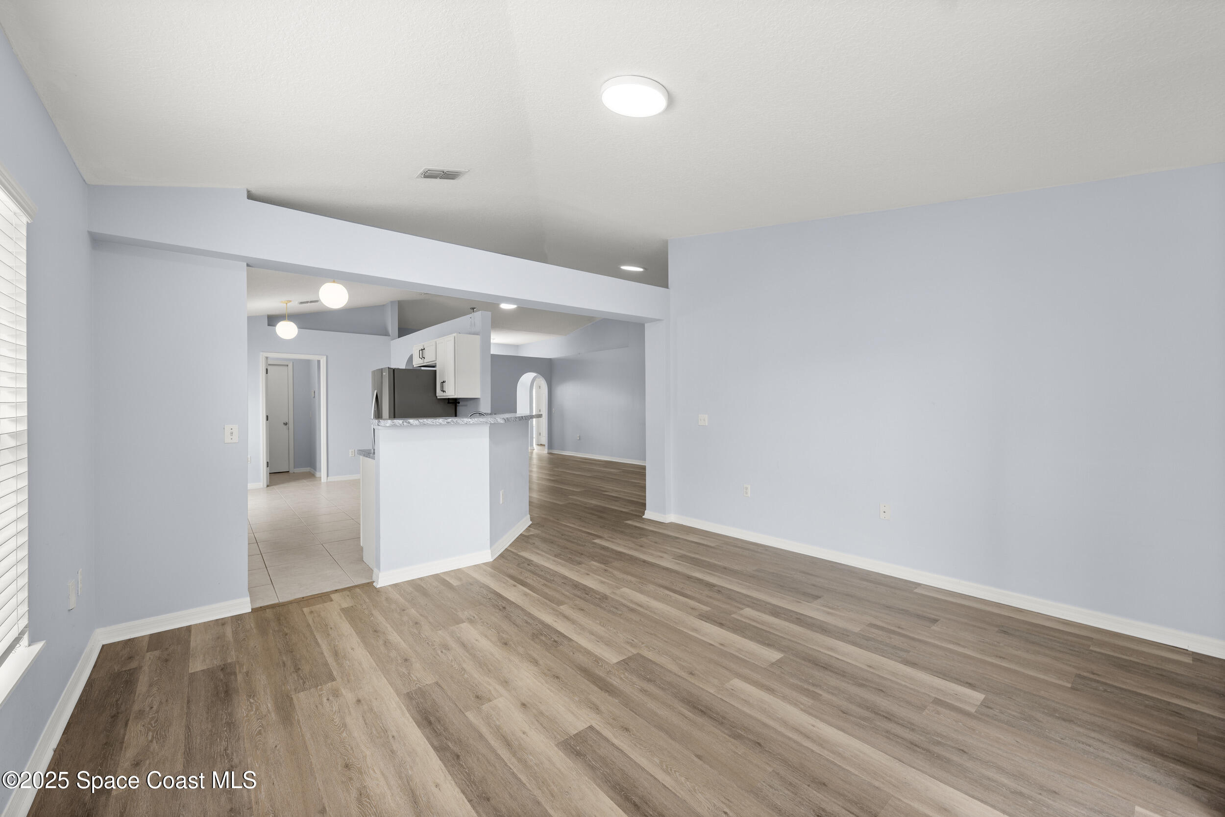 2100 Canopy Drive Melbourne, FL 32935 - Photo 25 of 53 a view of a kitchen with wooden floor