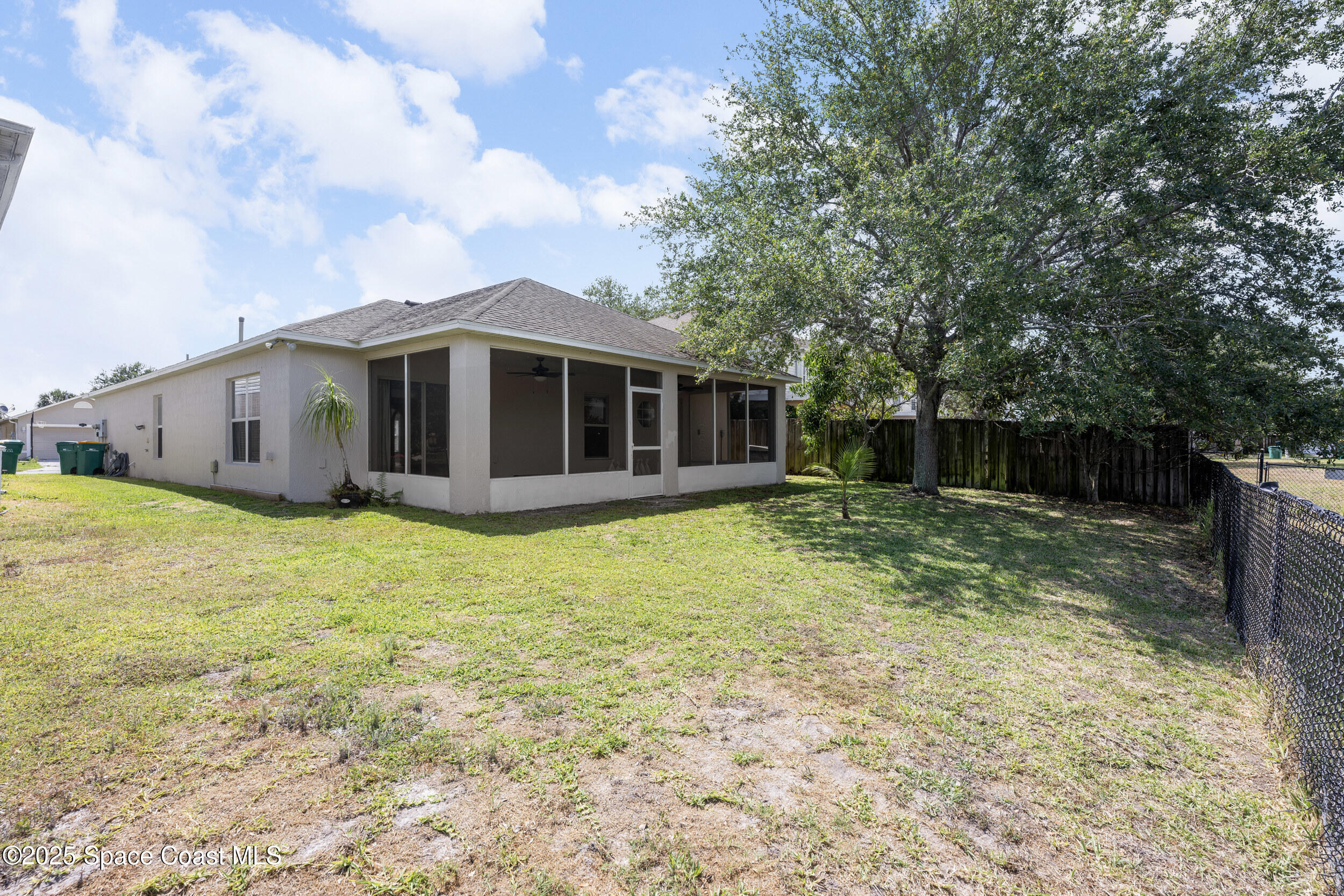2100 Canopy Drive Melbourne, FL 32935 - Photo 39 of 53 a front view of a house with garden
