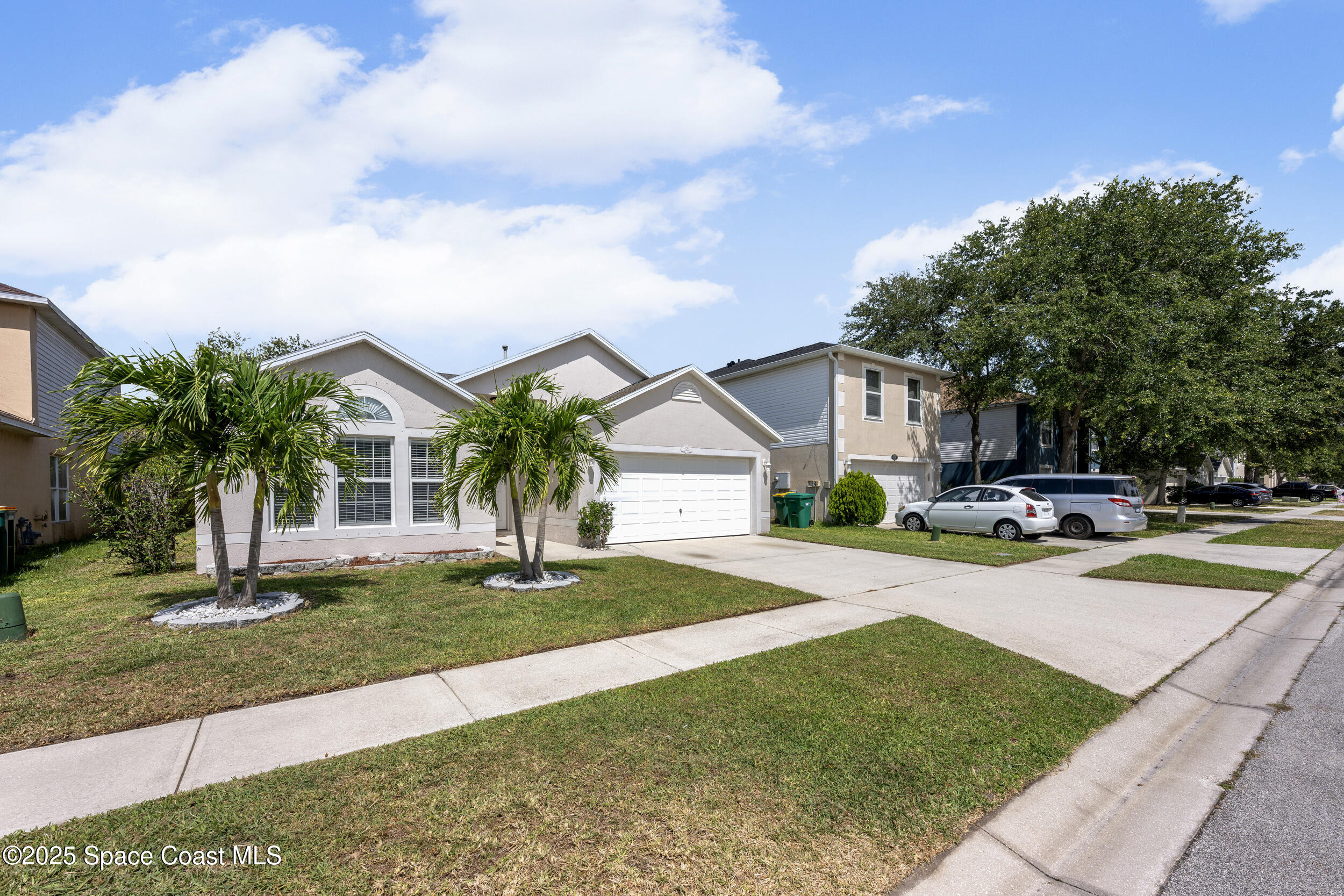 2100 Canopy Drive Melbourne, FL 32935 - Photo 41 of 53 a view of a house with swimming pool and a yard