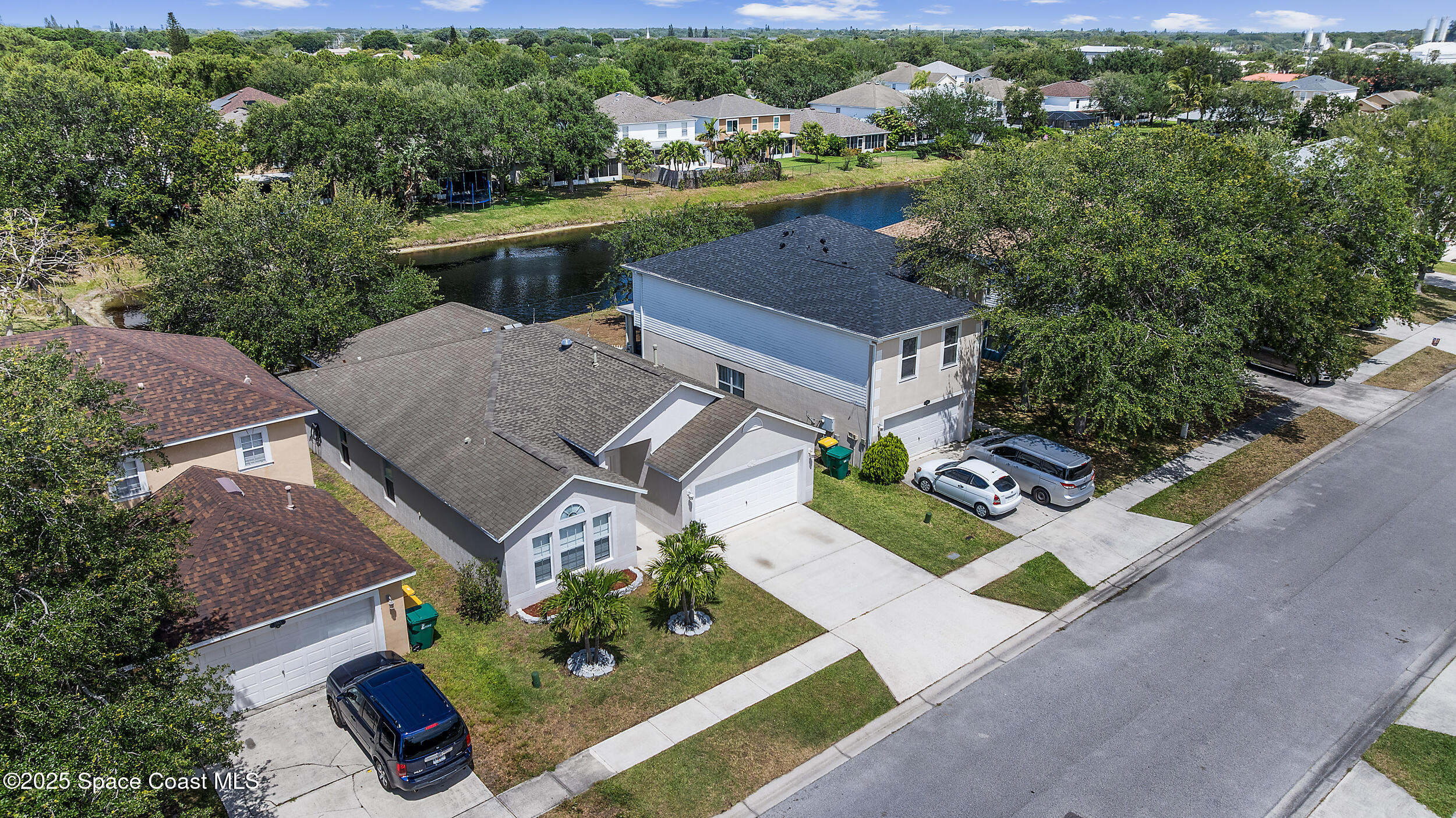 2100 Canopy Drive Melbourne, FL 32935 - Photo 43 of 53 an aerial view of a house with garden space and street view