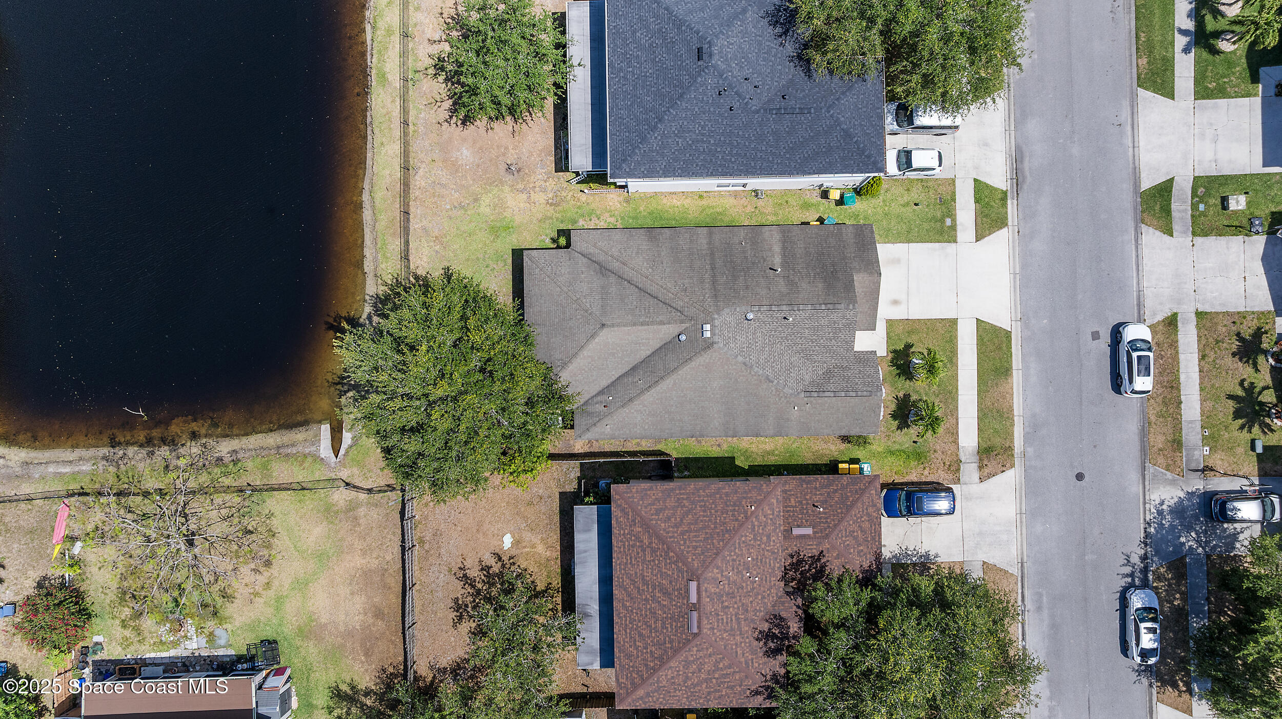 2100 Canopy Drive Melbourne, FL 32935 - Photo 44 of 53 an aerial view of a house with a yard