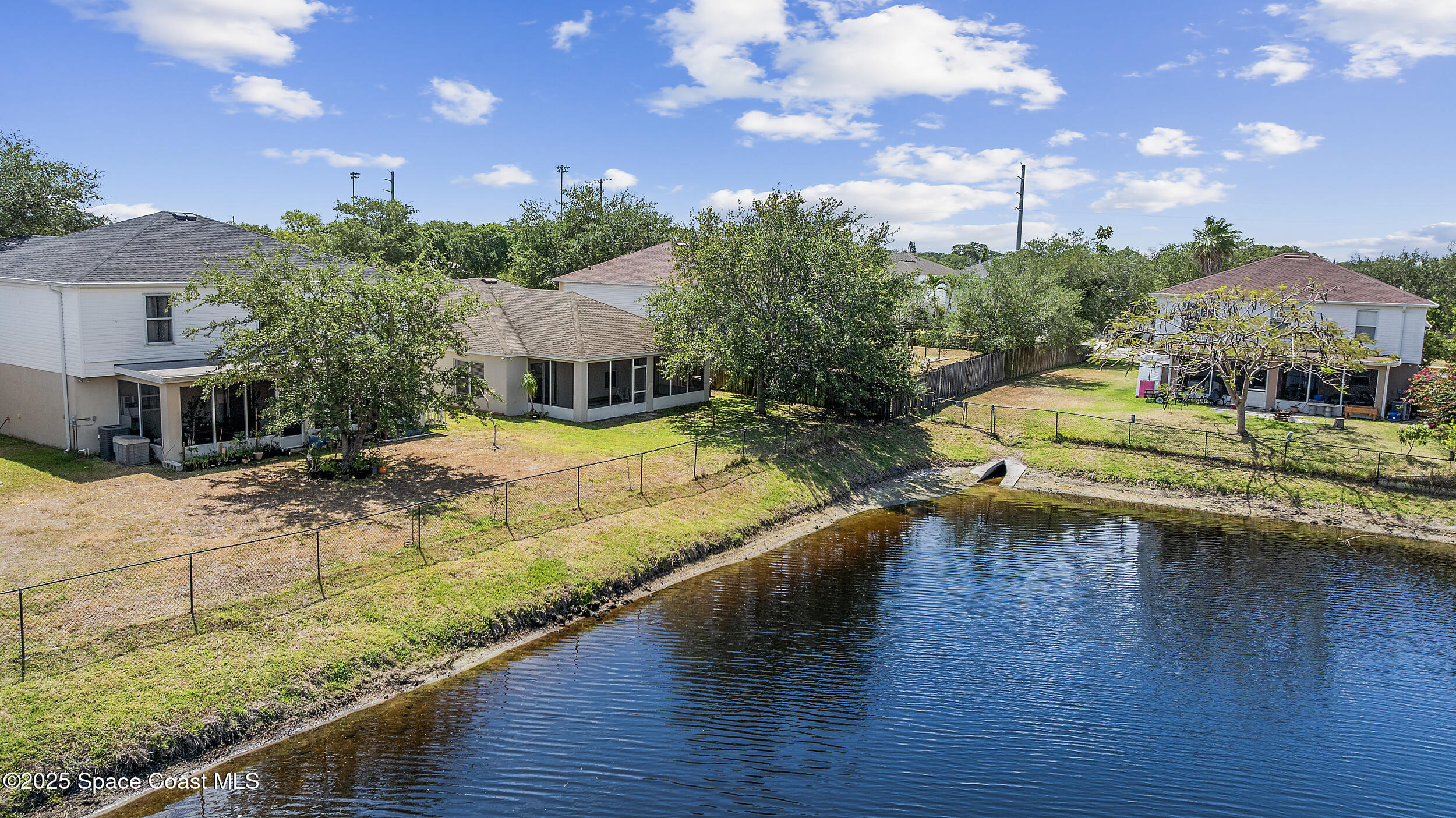 2100 Canopy Drive Melbourne, FL 32935 - Photo 50 of 53 a view of a house with swimming pool and sitting area