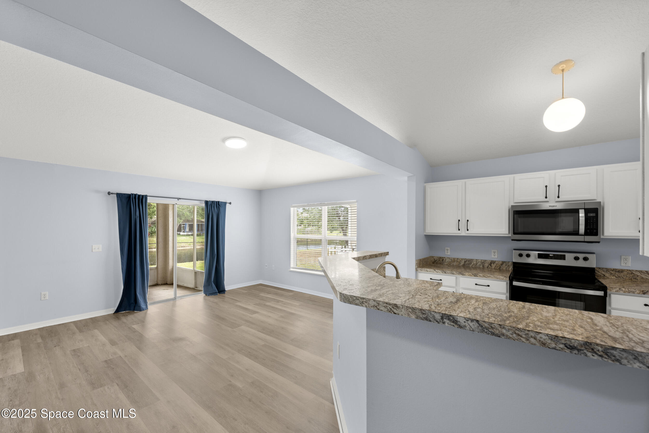 2100 Canopy Drive Melbourne, FL 32935 - Photo 5 of 53 a kitchen with granite countertop a refrigerator stove top oven a sink and dishwasher