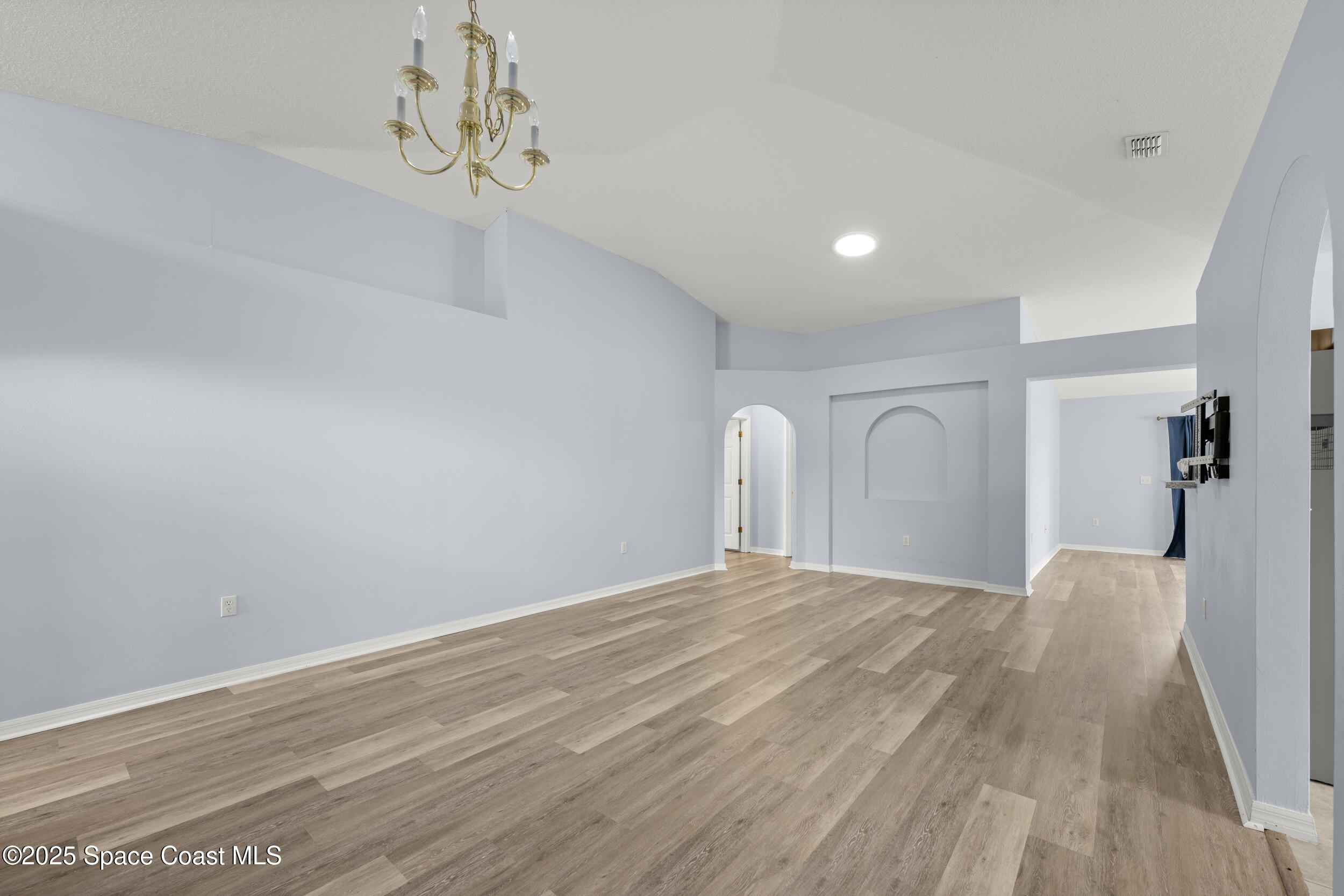 2100 Canopy Drive Melbourne, FL 32935 - Photo 7 of 53 a view of a livingroom with wooden floor