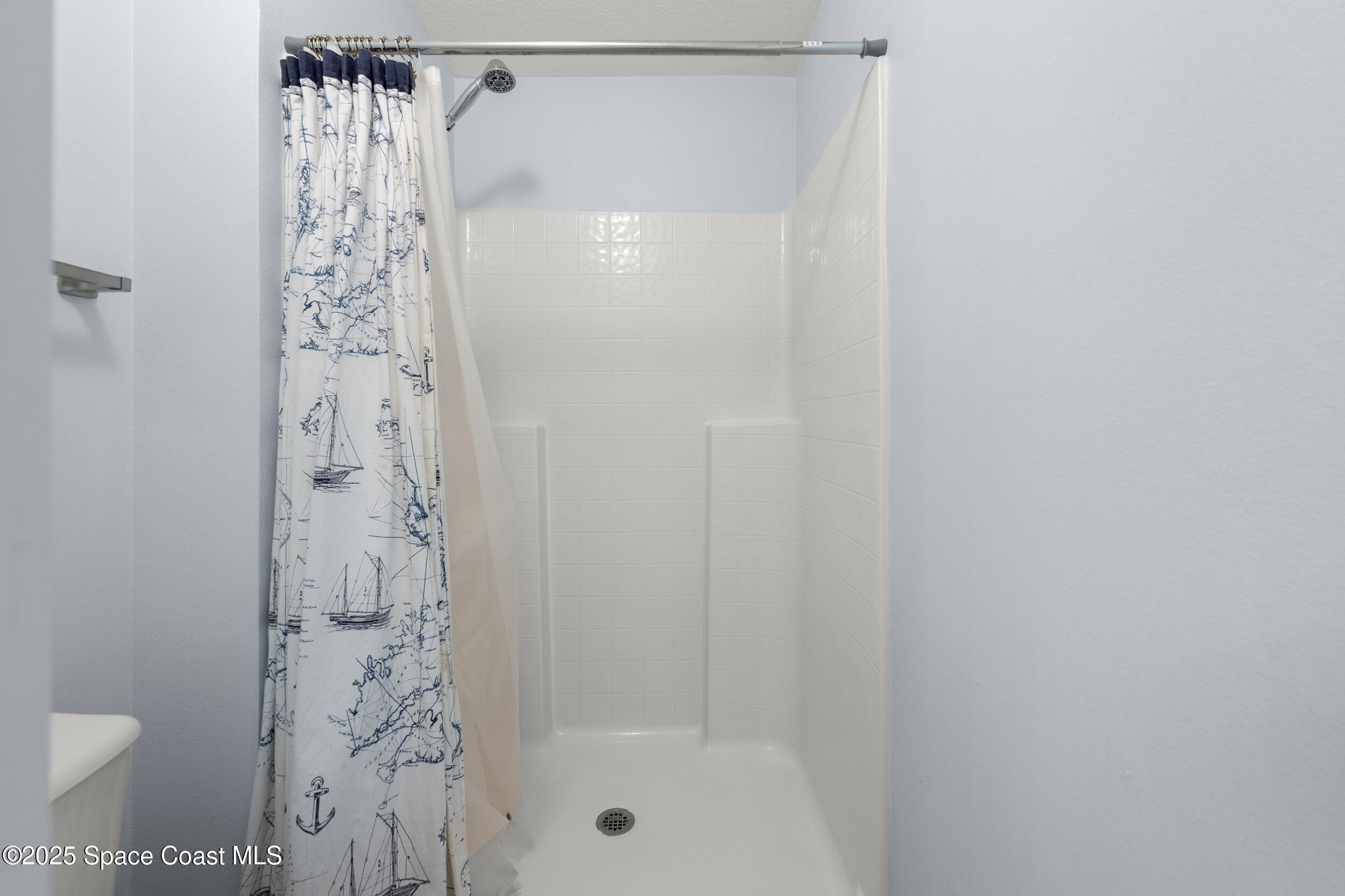 2100 Canopy Drive Melbourne, FL 32935 - Photo 10 of 53 a bathroom with a shower and a toilet