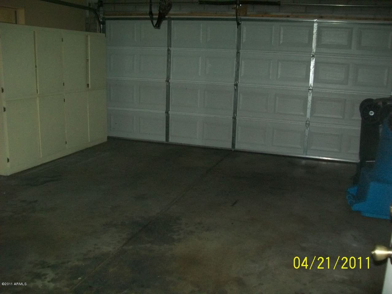 4027 West Ruth Avenue Phoenix, AZ 85051 - Photo 7 of 9 Garage with Built in Cabinets