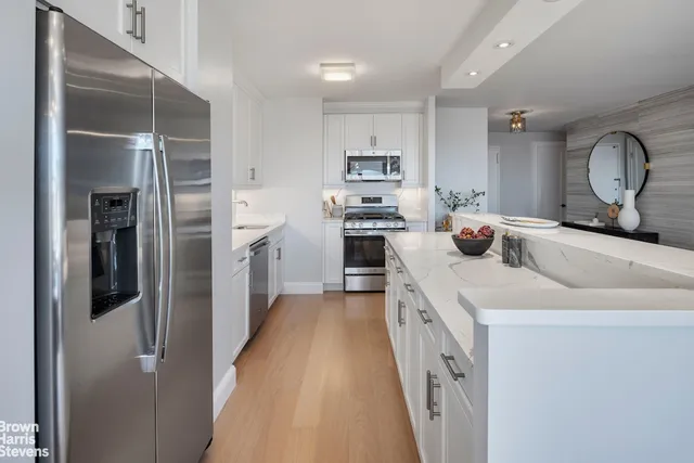 a kitchen with a sink and a refrigerator
