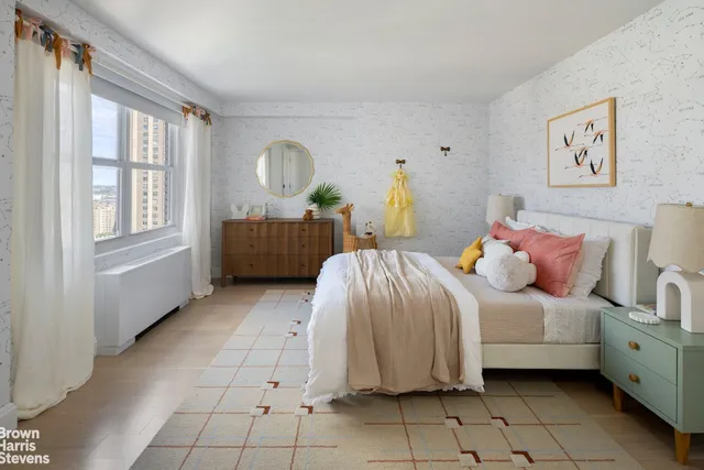 a spacious bedroom with a bed and a window