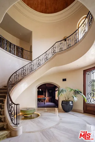 a view of front door with wooden floor