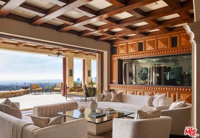 a view of living room with furniture and fireplace