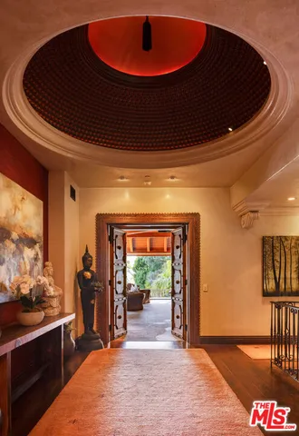 a view of a room with wooden floor and staircase