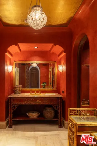 a view of a balcony with furniture and wooden floor