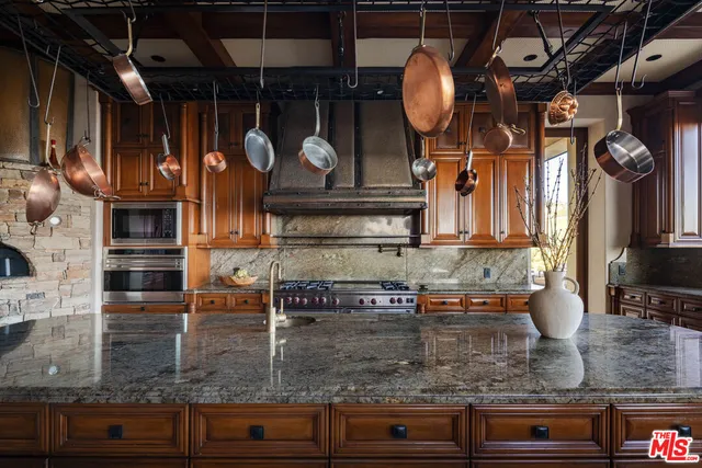 a view of a swimming pool with sitting area