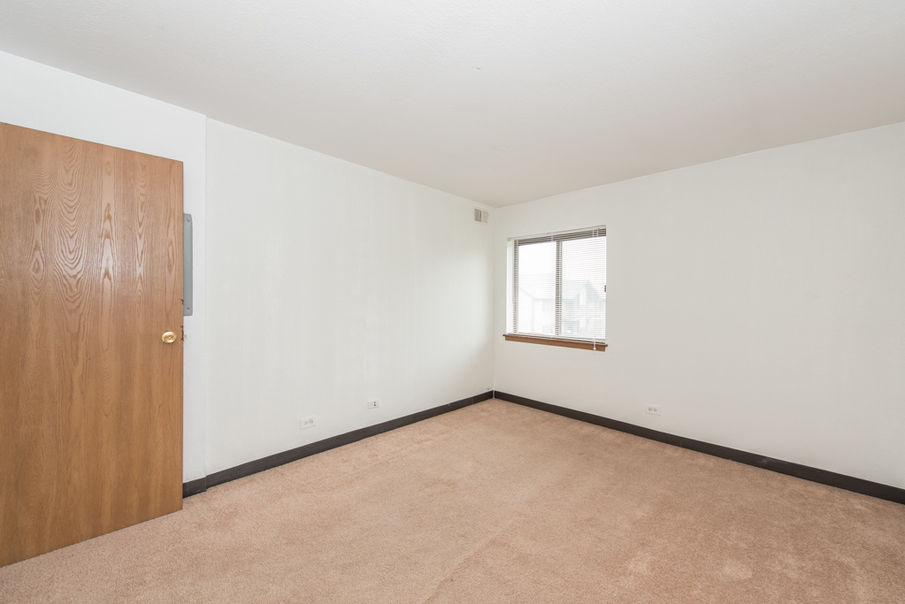2640 North Delany Road, Unit 202 Waukegan, IL 60087 - Photo 13 of 22 a view of an empty room with a window