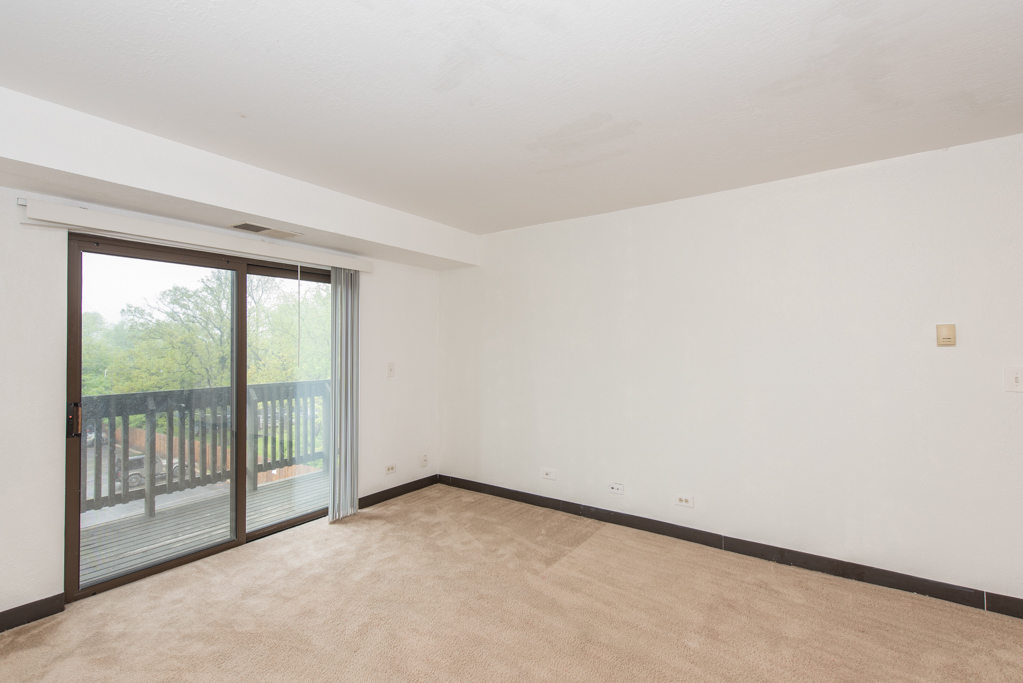 2640 North Delany Road, Unit 202 Waukegan, IL 60087 - Photo 8 of 22 a view of an empty room with a window