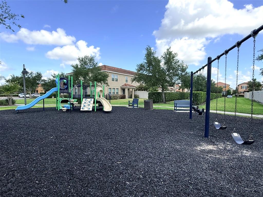 2084 Water Tupelo Way Ocoee, FL 34761 - Photo 29 of 34 a view of outdoor space with playground and green space