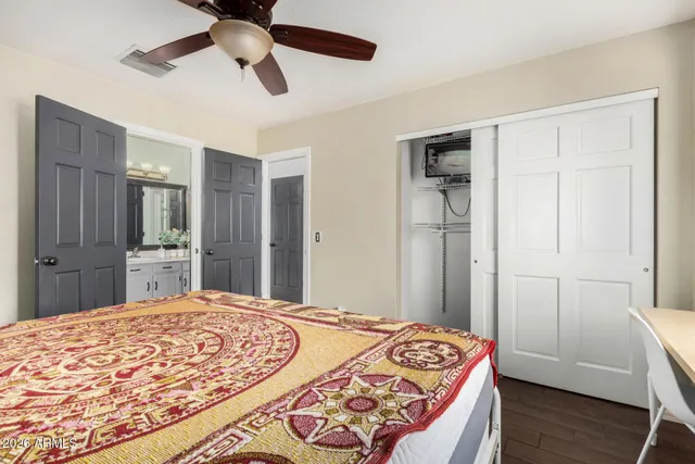 a bedroom with a bed and a dresser