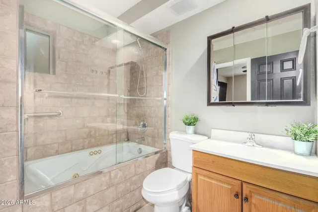 a bathroom with a sink a toilet and bathtub