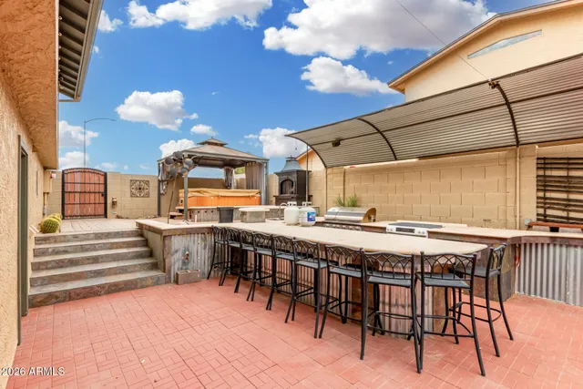a view of a swimming pool with a table and chairs