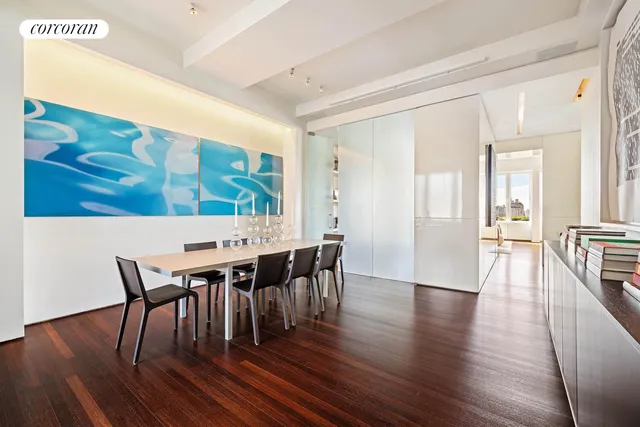a view of a dining room with furniture and window