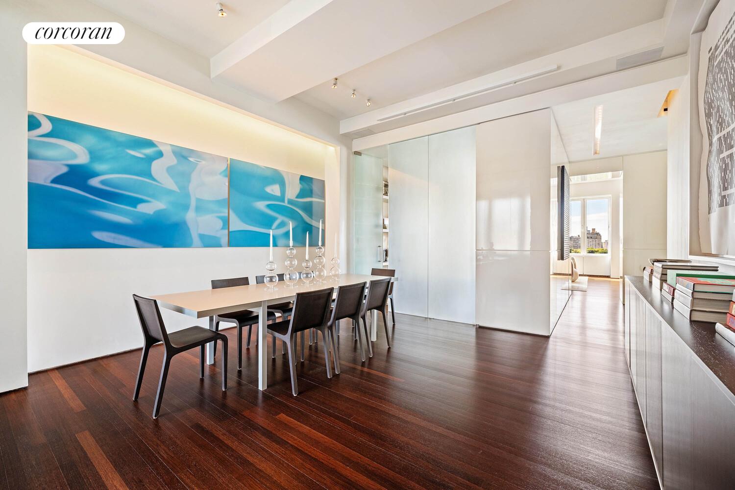 2 East 88th Street, Unit 10 Manhattan, NY 10128 - Photo 15 of 35 a view of a dining room with furniture and wooden floor