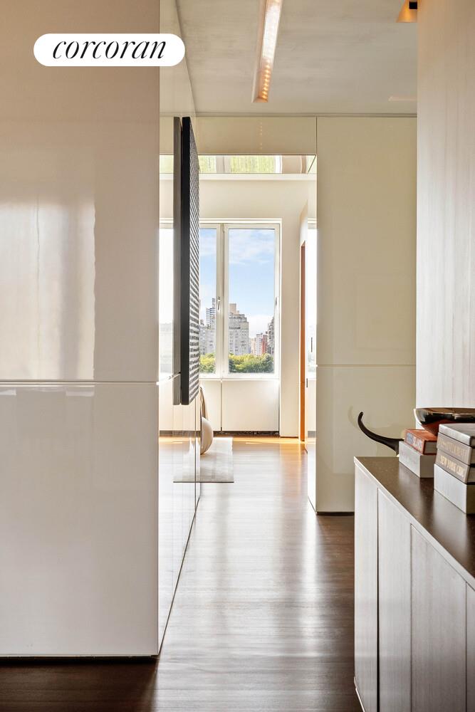 2 East 88th Street, Unit 10 Manhattan, NY 10128 - Photo 16 of 35 a view of a room with wooden floor and a window