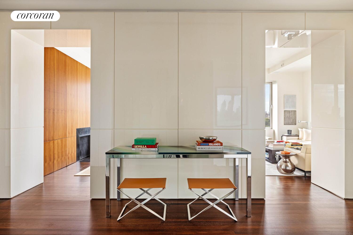 2 East 88th Street, Unit 10 Manhattan, NY 10128 - Photo 18 of 35 a view of a dining room with furniture and wooden floor