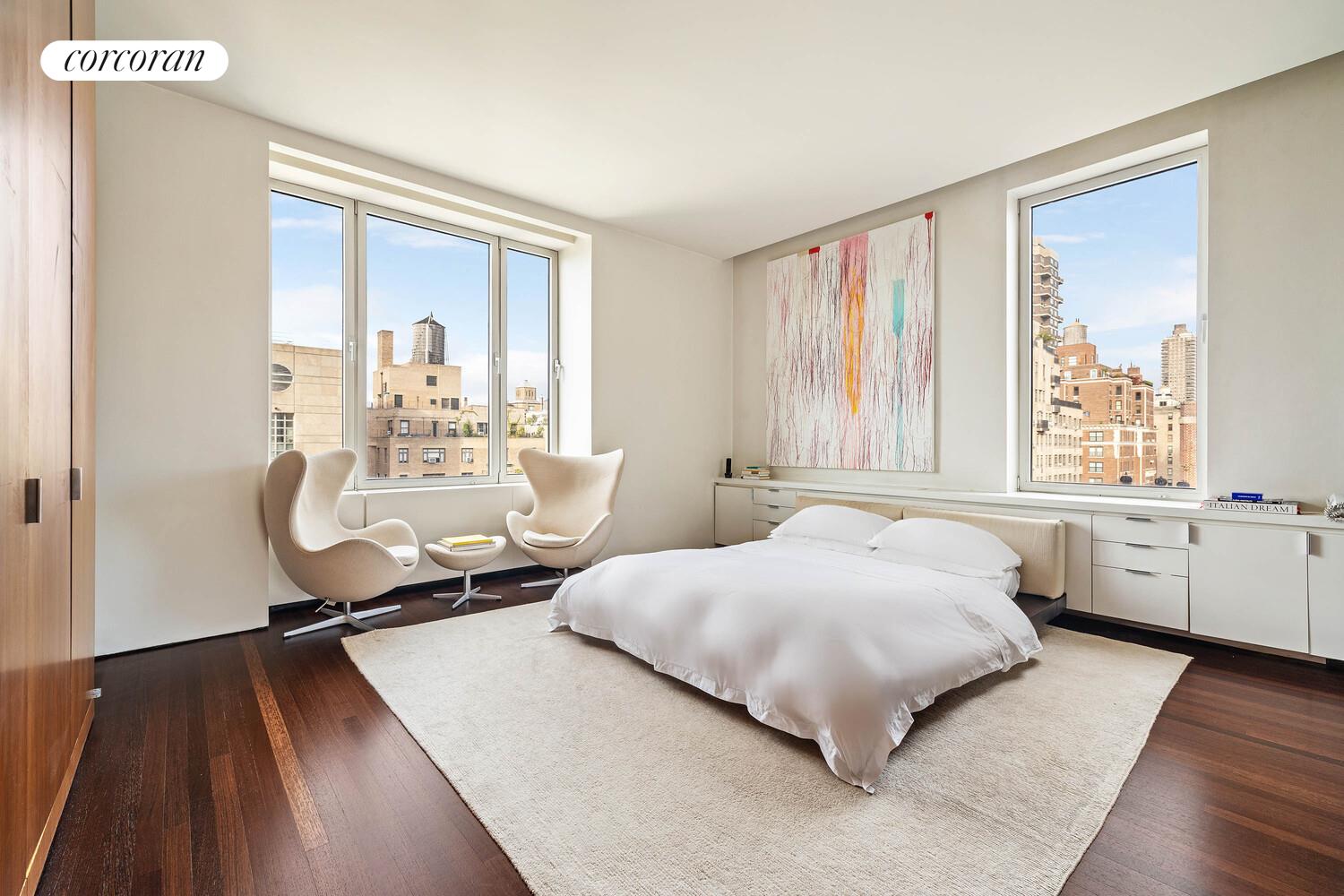 2 East 88th Street, Unit 10 Manhattan, NY 10128 - Photo 21 of 35 a bedroom with a bed and a large window