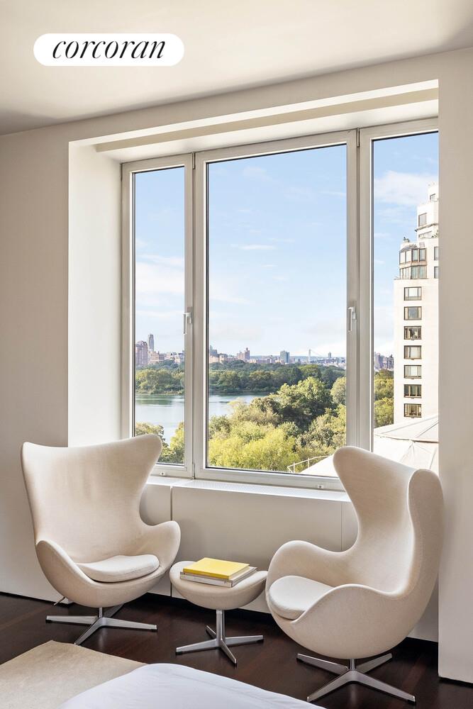 2 East 88th Street, Unit 10 Manhattan, NY 10128 - Photo 22 of 35 a living room with furniture and a large window