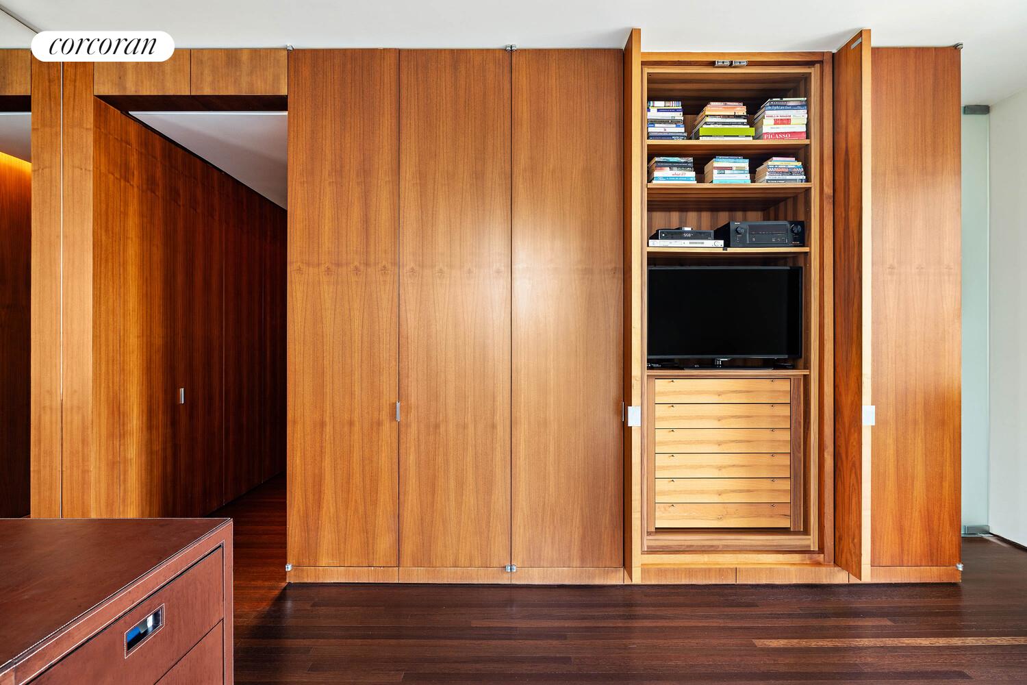 2 East 88th Street, Unit 10 Manhattan, NY 10128 - Photo 24 of 35 a view of a hallway with wooden floor and closet