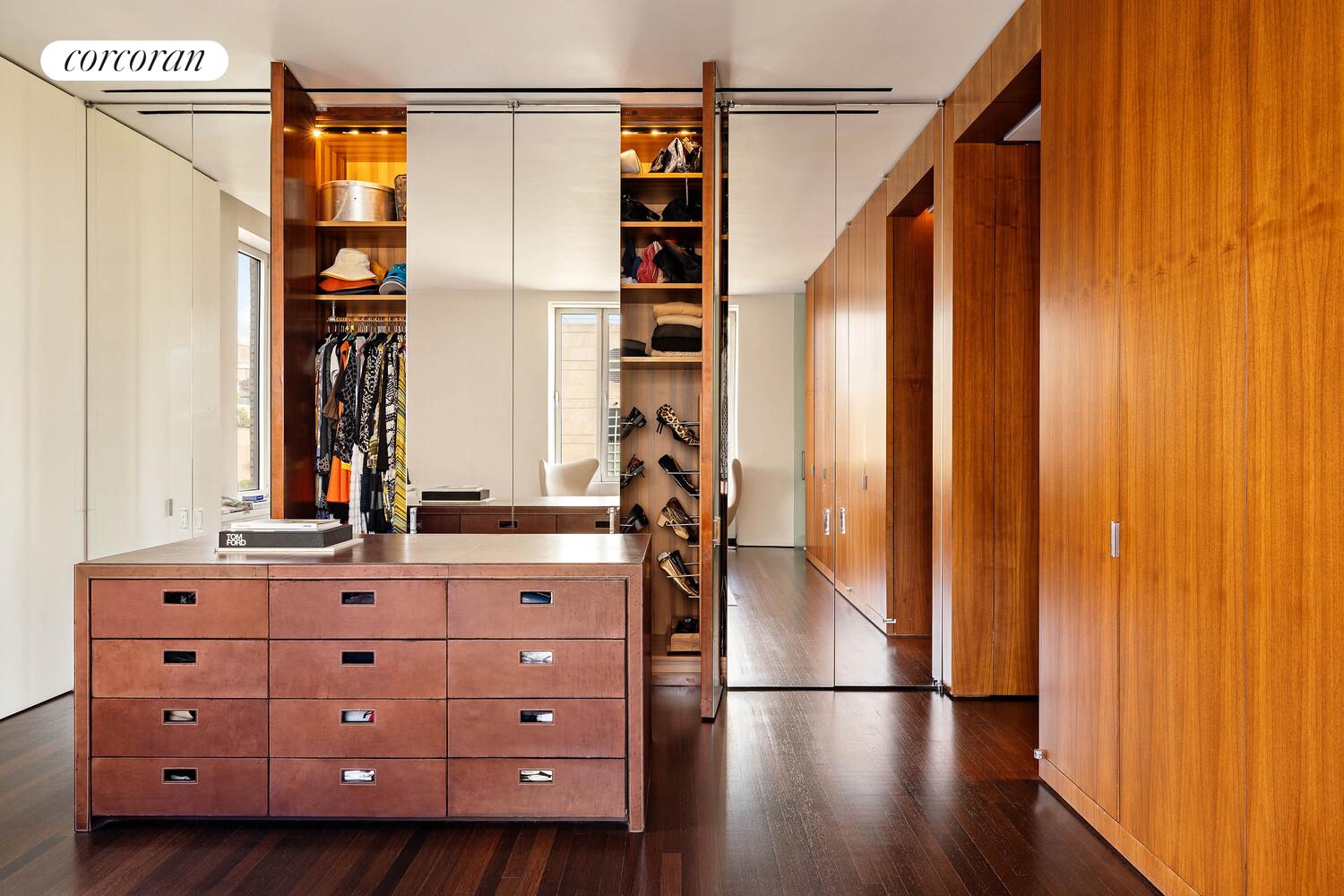2 East 88th Street, Unit 10 Manhattan, NY 10128 - Photo 25 of 35 a view of walk in closet with wooden floor