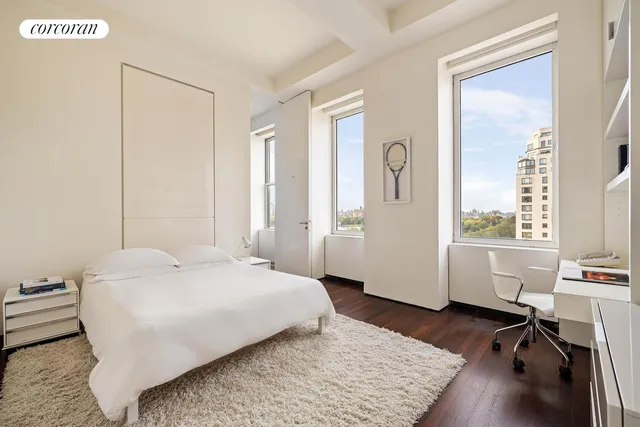 a view of walk in closet with wooden floor