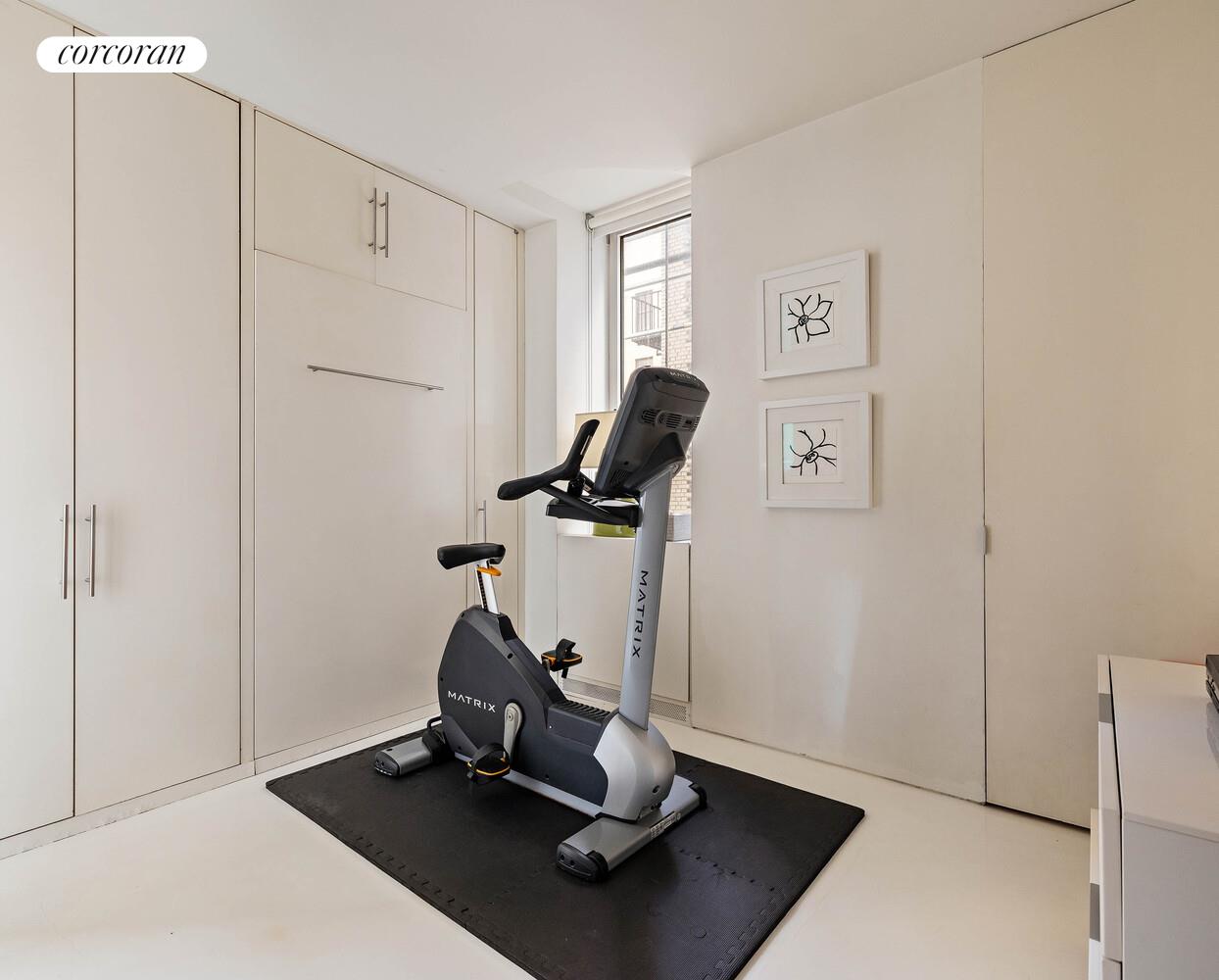 2 East 88th Street, Unit 10 Manhattan, NY 10128 - Photo 30 of 35 a view of workspace with gym equipment