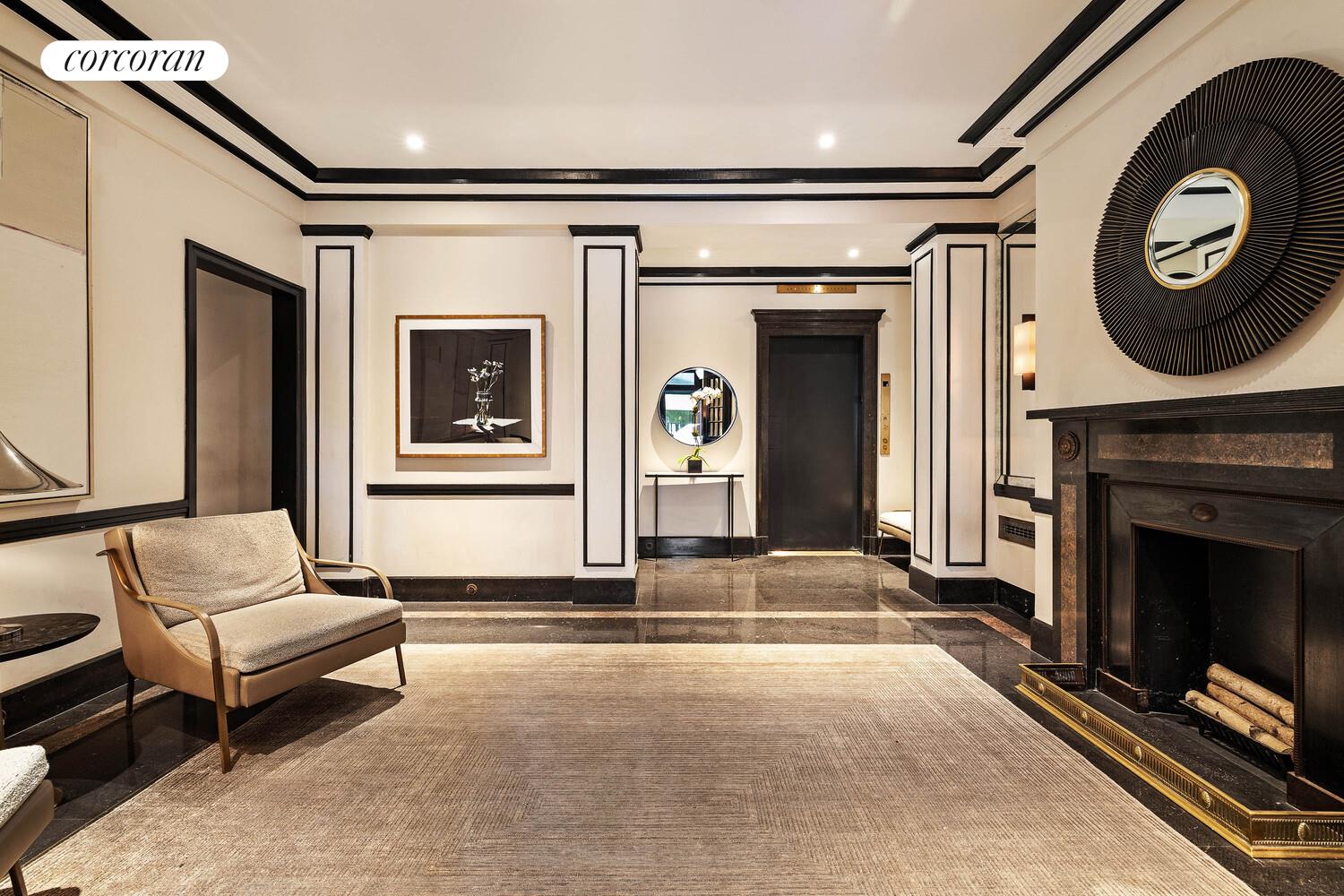 2 East 88th Street, Unit 10 Manhattan, NY 10128 - Photo 32 of 35 a living room with furniture and a fireplace