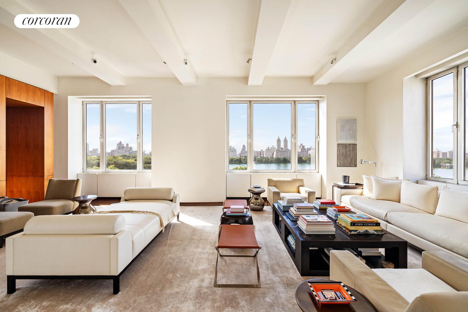 2 East 88th Street, Unit 10 Manhattan, NY 10128 - Photo 2 of 35 a living room with furniture and a large window